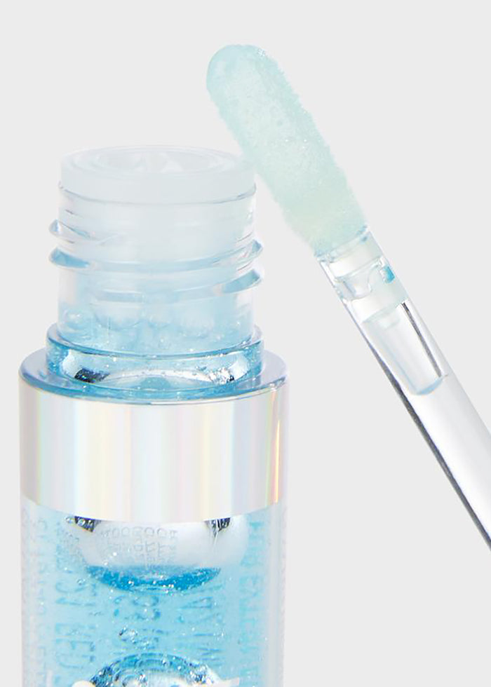 Lavender Stardust Pool Sparkle Cosmic Lip Gloss in light blue — detail view
