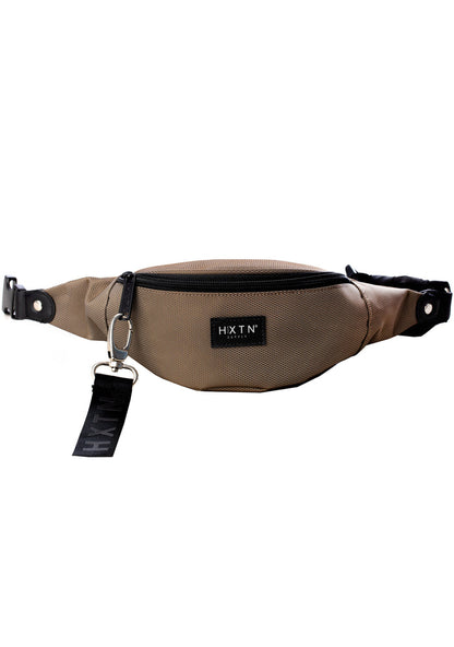 HXTN Supply Prime One Belt Bag in olive with zip-protected body and adjustable waist strap on festival rave belt bag — front view
