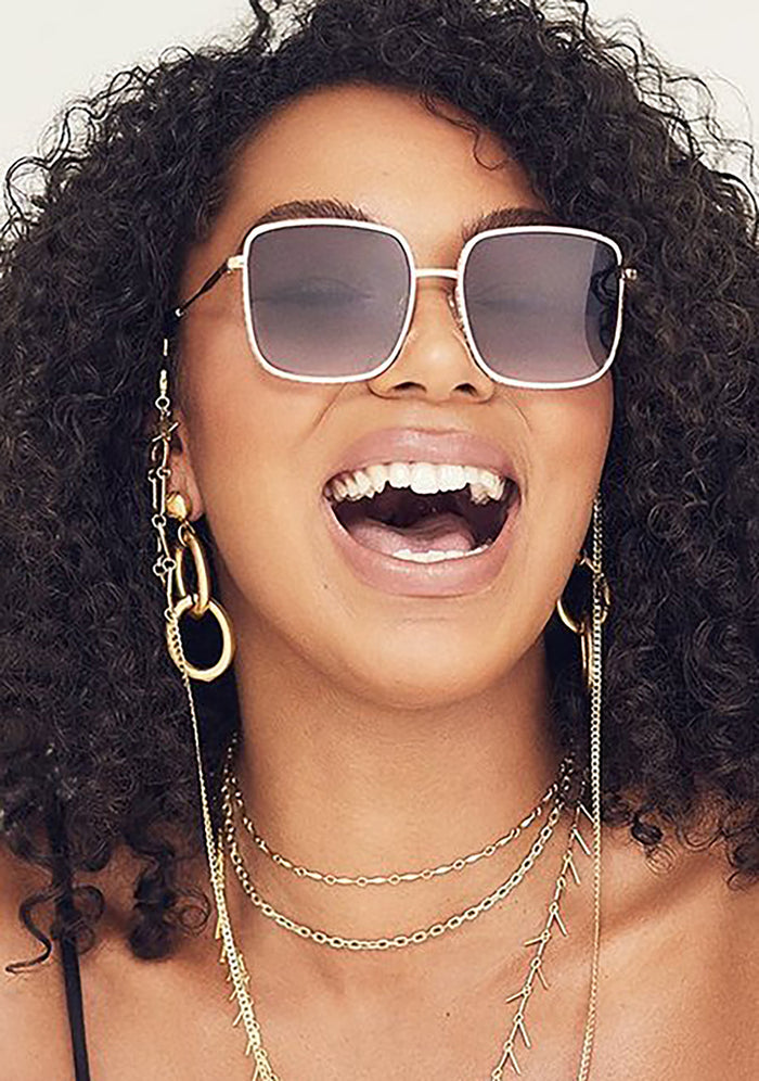 Quay Australia Real One Sunglasses in gold smoke — model view