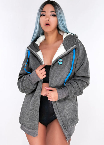 Sanrio Hangyodon Sherpa Zip Up Hoodie in charcoal with Hangyodon embroidery on sherpa-lined zip-up rave festival jacket — model front view
