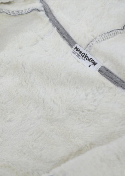 Sanrio Hangyodon Sherpa Zip Up Hoodie in charcoal with Hangyodon embroidery on sherpa-lined zip-up rave festival jacket — embroidery detail view