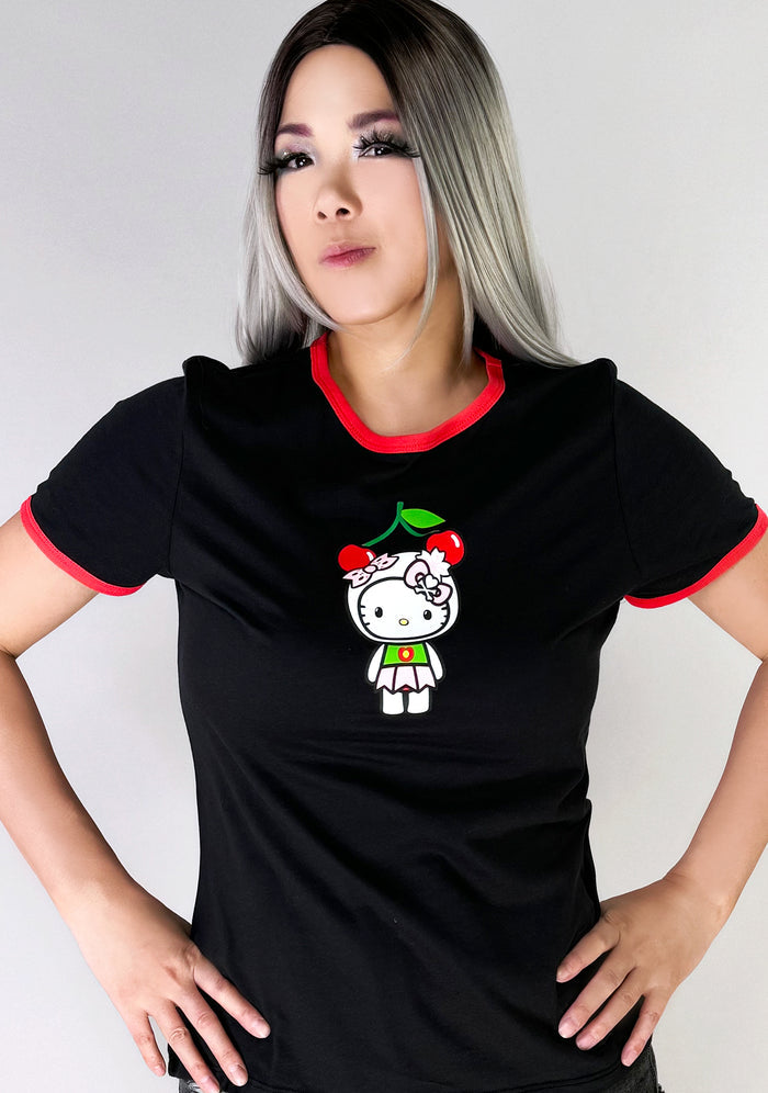 tokidoki x Sanrio Hello Kitty Cherry Kitty Ringer Tee in black red with cherry Hello Kitty graphic and contrast red binding on cotton kawaii rave tee — model front view
