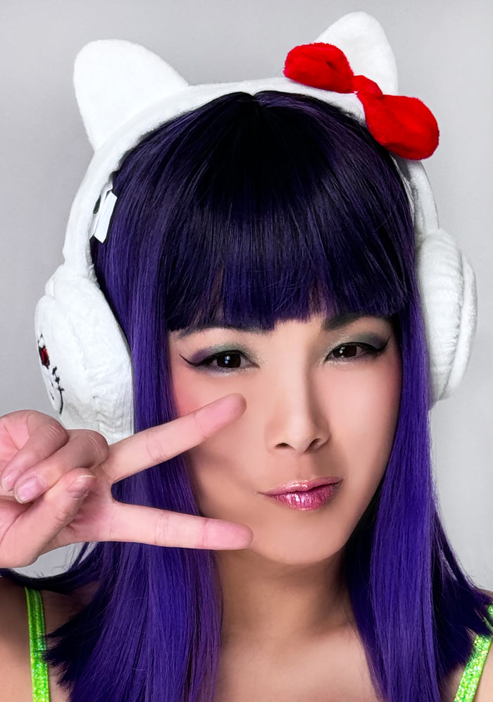 Bioworld Sanrio Hello Kitty Foldable Cosplay Earmuff in white red with 3D Hello Kitty ears and red bow detail on kawaii rave festival hair accessory — model view
