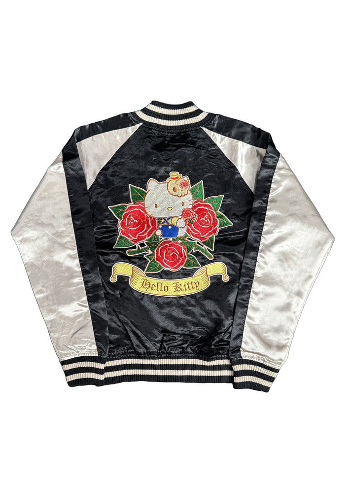 Sanrio Hello Kitty Rose Tattoo Bomber Jacket in black gold with Hello Kitty embroidery and rose tattoo design on satin fabric — front view