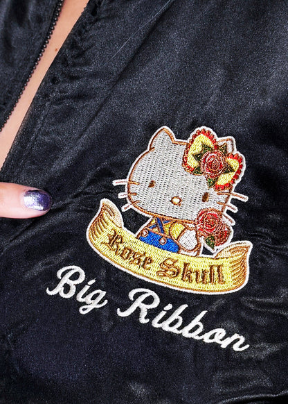 Sanrio Hello Kitty Rose Tattoo Bomber Jacket in black gold with Hello Kitty embroidery and rose tattoo design on satin fabric — sleeve detail view