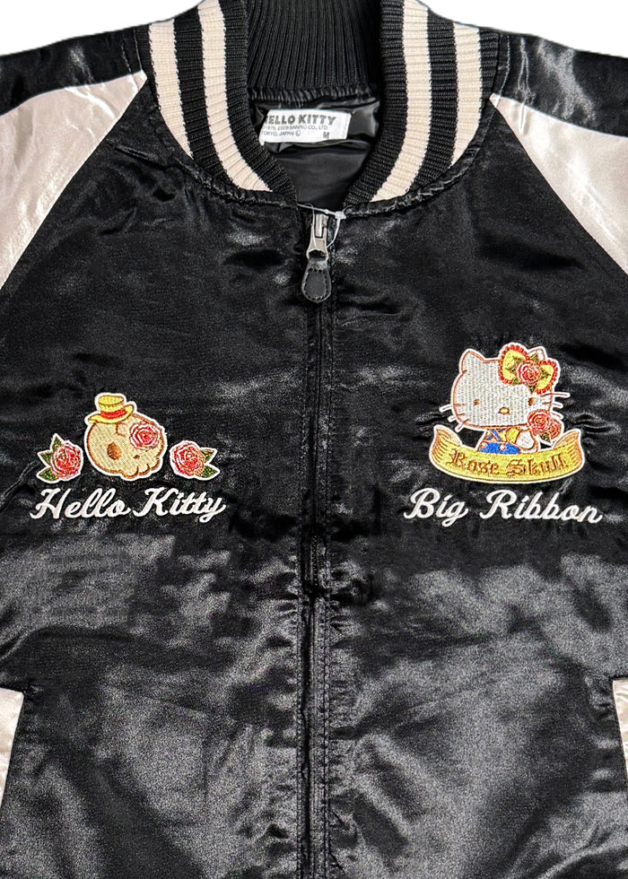 Sanrio Hello Kitty Rose Tattoo Bomber Jacket in black gold with Hello Kitty embroidery and rose tattoo design on satin fabric — lining detail view