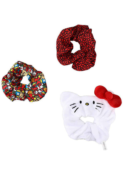 Bioworld Sanrio Hello Kitty Scrunchies 3 Pack Set in multicolor with 2 satin AOP scrunchies and 1 plush Hello Kitty face scrunchie on kawaii rave hair accessories — front view