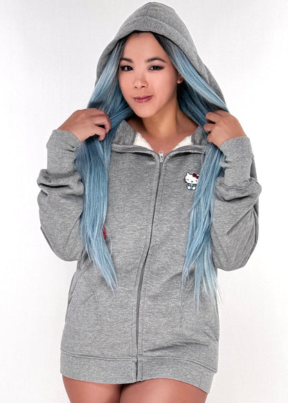 Sanrio Hello Kitty Sherpa Zip Up Hoodie in grey with Hello Kitty embroidery on sherpa-lined zip-up rave festival jacket — model detail view