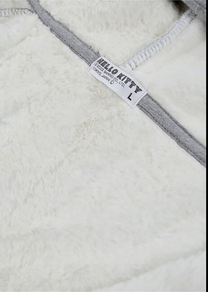 Sanrio Hello Kitty Sherpa Zip Up Hoodie in grey with Hello Kitty embroidery on sherpa-lined zip-up rave festival jacket — embroidery detail view