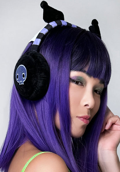 Bioworld Sanrio Kuromi Foldable Cosplay Earmuff in black purple with 3D Kuromi ears and foldable microfleece design on kawaii rave festival hair accessory — model view