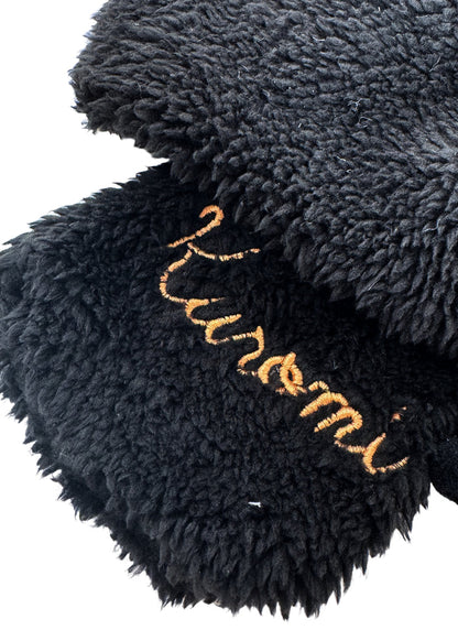 Sanrio Kuromi Plush Muffler Scarf in black with Kuromi plush face on knit muffler rave winter accessory — texture detail view