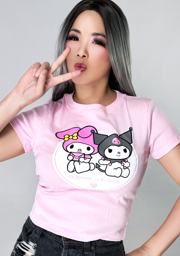 Bioworld Sanrio My Melody and Kuromi BFF Tee in pink with My Melody and Kuromi front graphic on kawaii fandom rave festival top — model view
