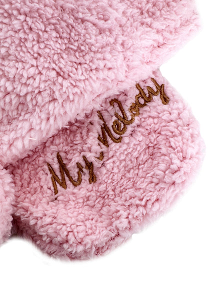 Sanrio My Melody Plush Muffler Scarf in pink with My Melody plush face on knit muffler rave winter accessory — texture detail view