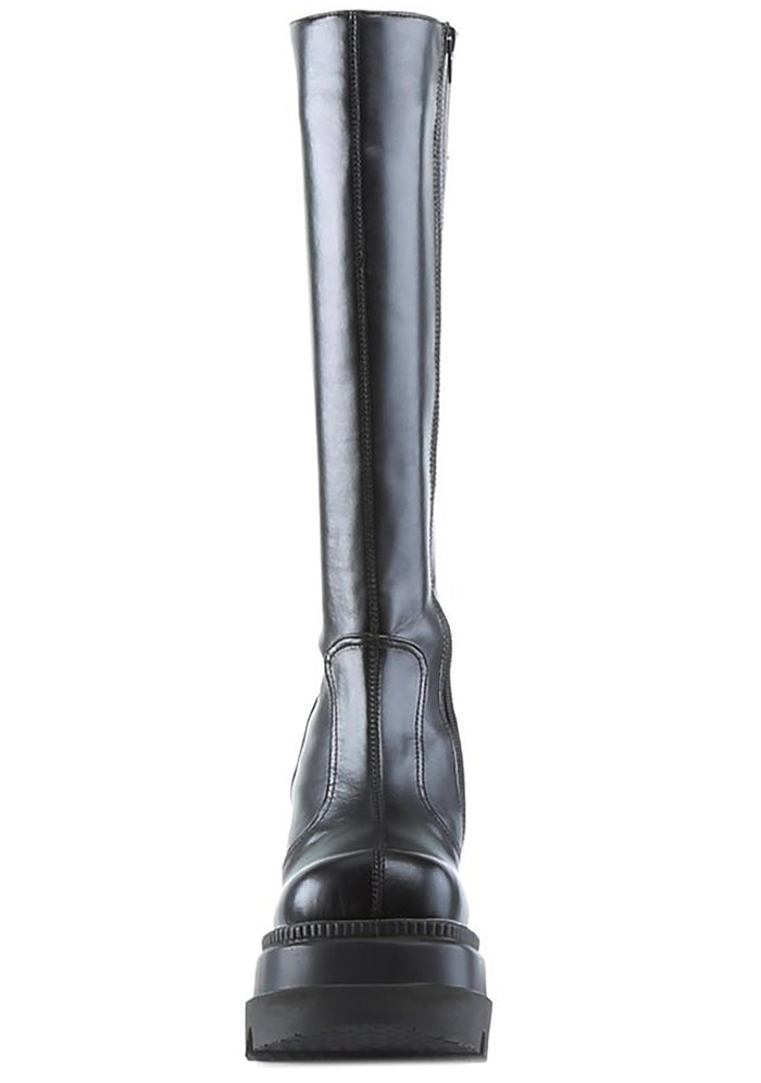 Demonia SHAKER 100 Total Blackout Black Platform Boots in black vegan PU leather showing 4.5 inch stacked wedge platform height — side view