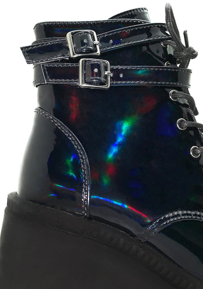 Demonia SHAKER 52 Hologram Black Platform Boots in iridescent holographic vegan leather showing wedge platform height and buckle strap detail — side view
