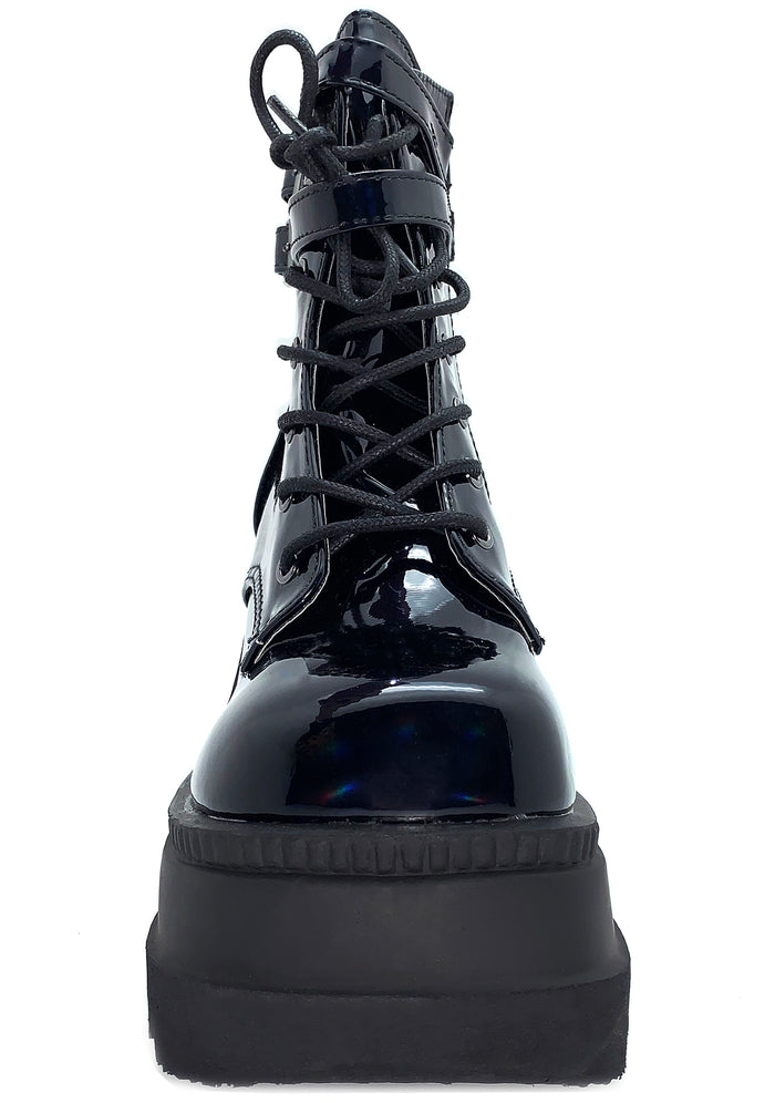 Demonia SHAKER 52 Hologram Black Platform Boots in iridescent holographic vegan leather showing lace-up front closure and ankle strap hardware — detail shot