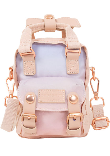 Doughnut Official Sky x Ribbon Series Macaroon Tiny Crossbody Bag in soft sunrise pink ombre with rose gold hardware and leather trim on festival crossbody bag — front view