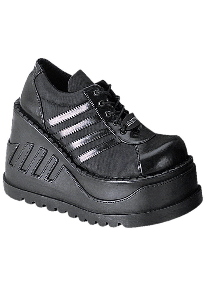 Demonia STOMP 08 Black Rave Platform Sneakers in black vegan leather with sporty stripe detail and 4.75 inch chunky rubber wedge platform sole — front view