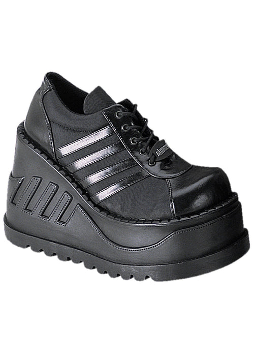 Demonia STOMP 08 Black Rave Platform Sneakers in black vegan leather with sporty stripe detail and 4.75 inch chunky rubber wedge platform sole — front view