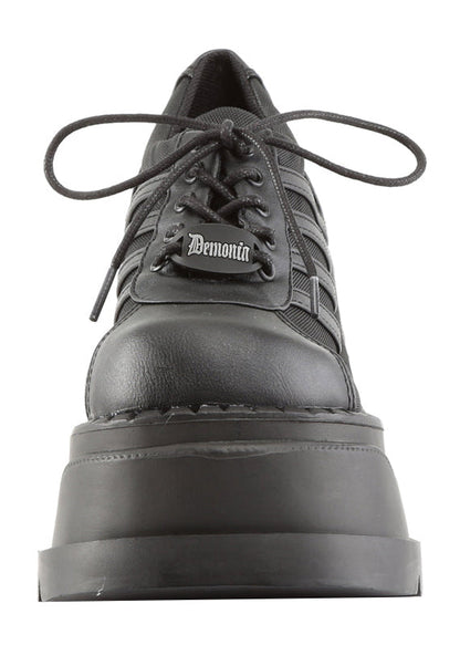 Demonia STOMP 08 Black Rave Platform Sneakers in black vegan leather showing 4.75 inch chunky wedge platform height and traction sole — side view