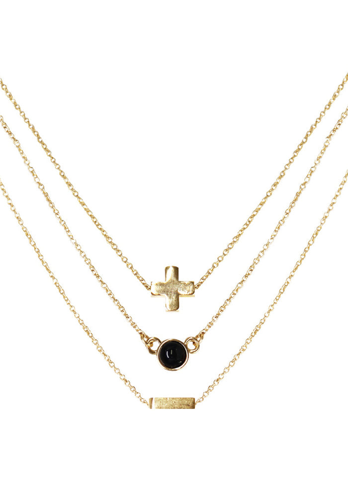 Charged Strength Onyx Delicate Chain Necklace Set in gold with raw black onyx stone on three 18k gold plated chain crystal festival necklace set — front view