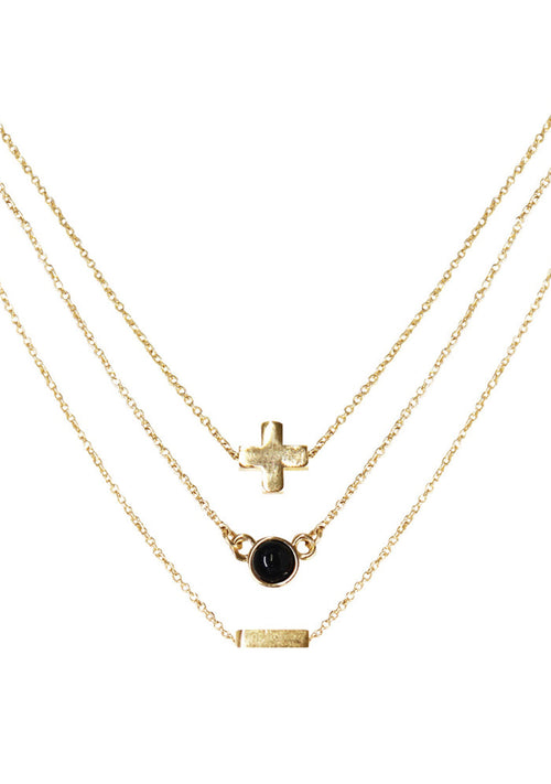 Charged Strength Onyx Delicate Chain Necklace Set in gold with raw black onyx stone on three 18k gold plated chain crystal festival necklace set — front view