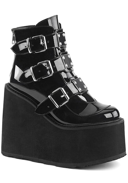Demonia SWING 105 Dark Resistance Patent Black Platform Boots in black patent leather with 3 metal plate buckle straps and 5.5 inch EVA foam platform — front view