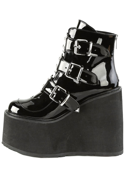 Demonia SWING 105 Dark Resistance Patent Black Platform Boots in black patent leather showing 3 buckle metal plate detail and traction sole — detail shot