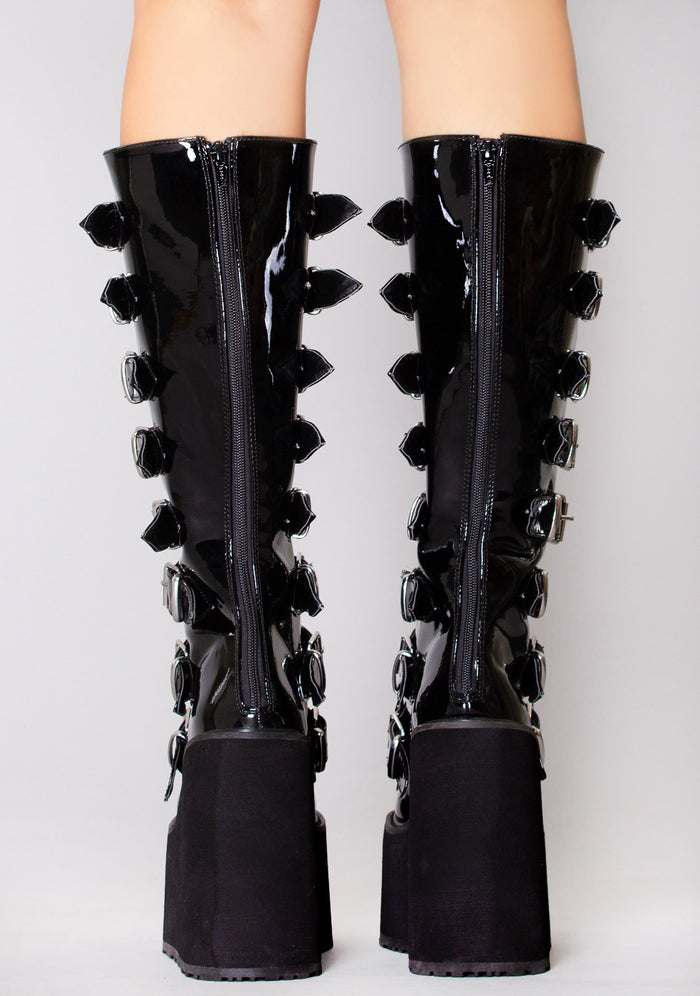 Demonia SWING 815 Ultimate Weapon Patent Black Platform Boots in black patent leather with back metal zip closure worn by model — back view