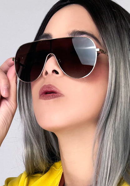 Dime Optics Tarzana Polarized Sunglasses in gold brown — model side view