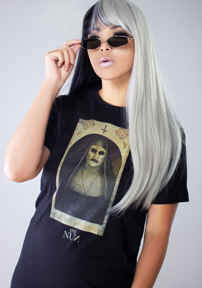 Bioworld The Nun Poster Unisex Tee in black with The Nun movie poster front graphic on horror fandom rave festival top — model view