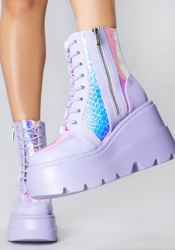 Front view of the exclusive RADIO Fairy Kiss lavender platform boots on-model, showcasing the purple laces, secure metal eyelets, and lightweight chunky festival boot silhouette.