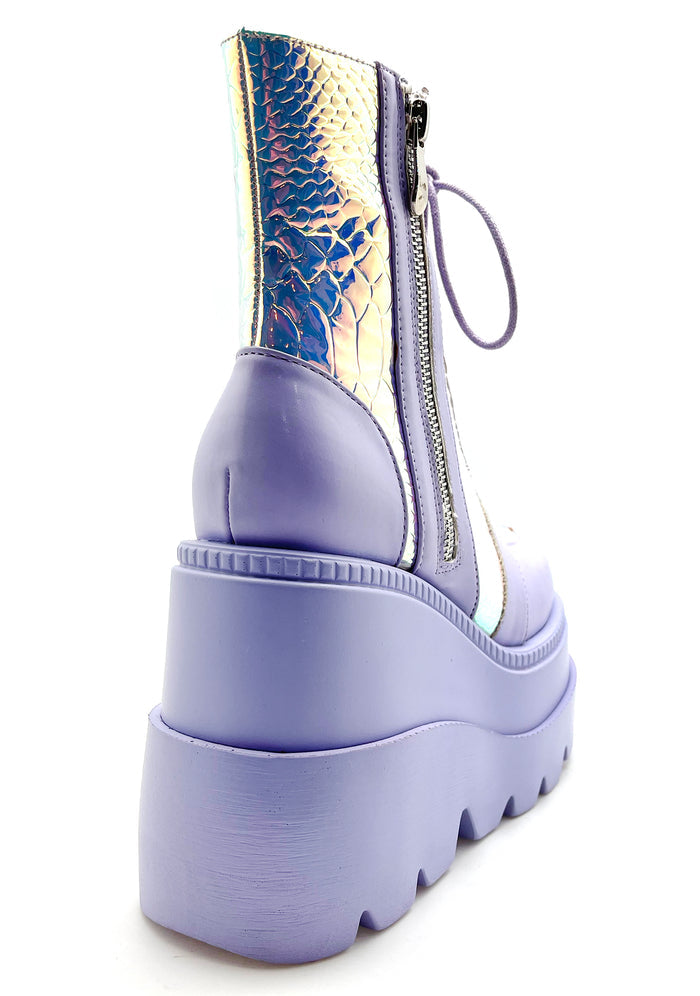 Close-up view of the inner side of the lavender RADIO platform boot, highlighting the convenient side metal zipper closure and the sleek, contoured fit of the sole.