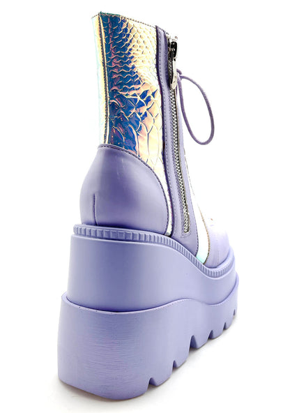Close-up view of the inner side of the lavender RADIO platform boot, highlighting the convenient side metal zipper closure and the sleek, contoured fit of the sole.