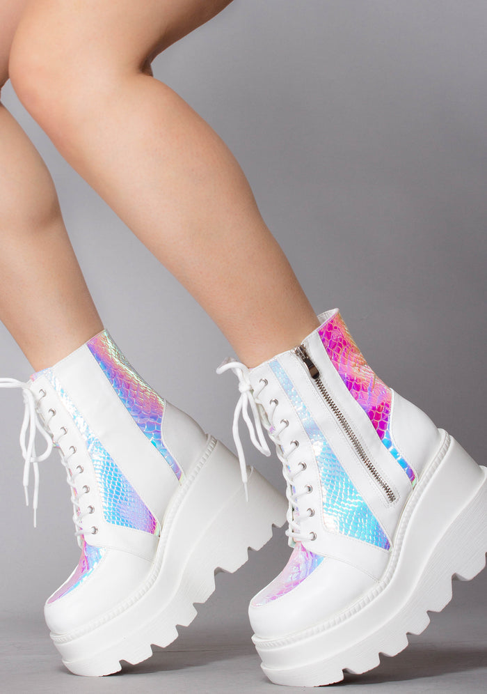 Side profile view of the exclusive Liquid Love rave platform boots, highlighting the vibrant teal and purple shifts of the iridescent python side panels under studio lighting.