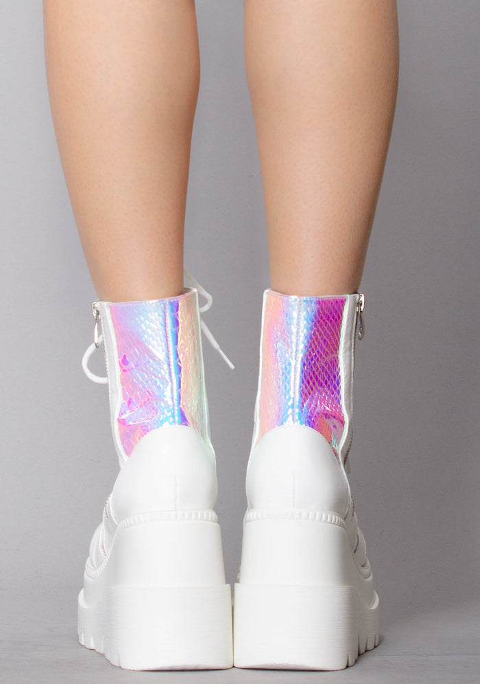Rear view of the Liquid Love festival boots on-model, detailing the snug ankle fit, clean white back stitching, and the 4.5-inch stacked block heel.