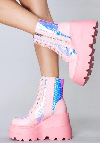 Side angle view of the exclusive RADIO Pink Poison platform boots, showcasing the shimmering iridescent python texture panels under studio lighting.
