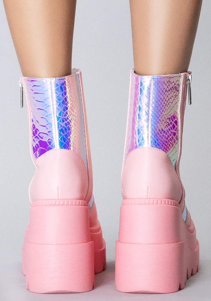 Rear view of the Pink Poison platform boots on-model, detailing the high-top ankle fit, clean back panel stitching, and the stacked 3-inch block heel.