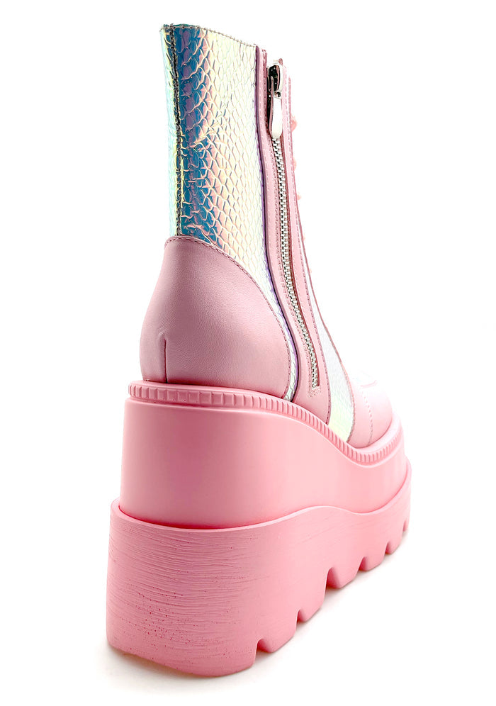 Close-up view of the inner side of the pink RADIO platform boot, highlighting the convenient side metal zipper closure and the sleek, contoured fit of the sole.