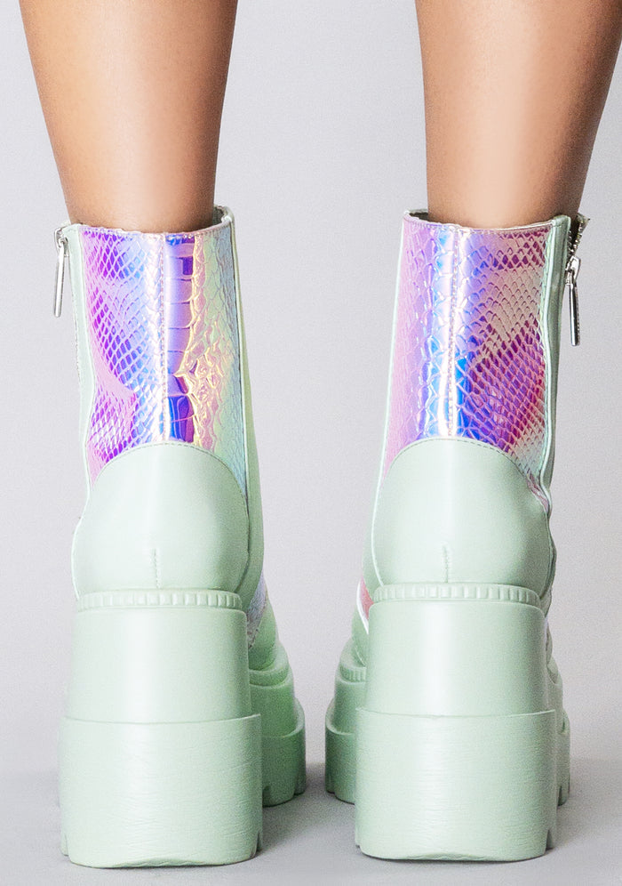 Rear view of the Prismatic Sage platform boots on-model, detailing the high-top ankle fit, clean back panel stitching, and the stacked 3-inch block heel.