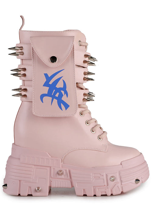 Side studio profile of Anthony Wang X WTF CV Chem Baby Metal Pink platform boots showing the pastel pink faux leather upper, utility side pocket with blue tribal symbol graphic, and spiked chunky platform soles